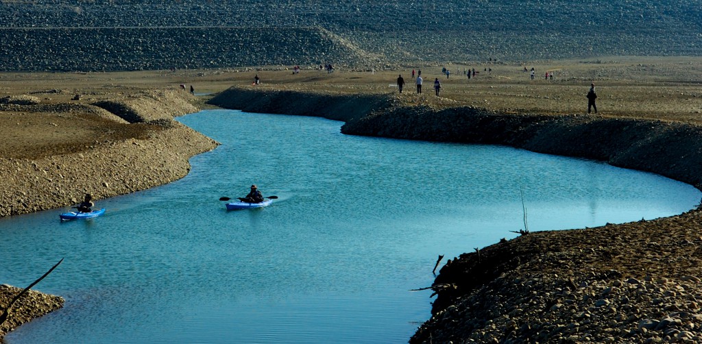 Kayakers row near the area of Folsom Lake formerly known as Dyke 8.